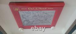 Une œuvre unique : croquis/dessin/boîte à ombres authentiquement signée sur un Etch-A-Sketch